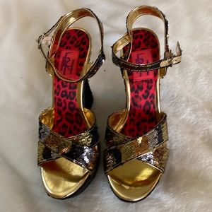 Beautiful platform shoes . Brand new FRH inside heels.black and gold ,